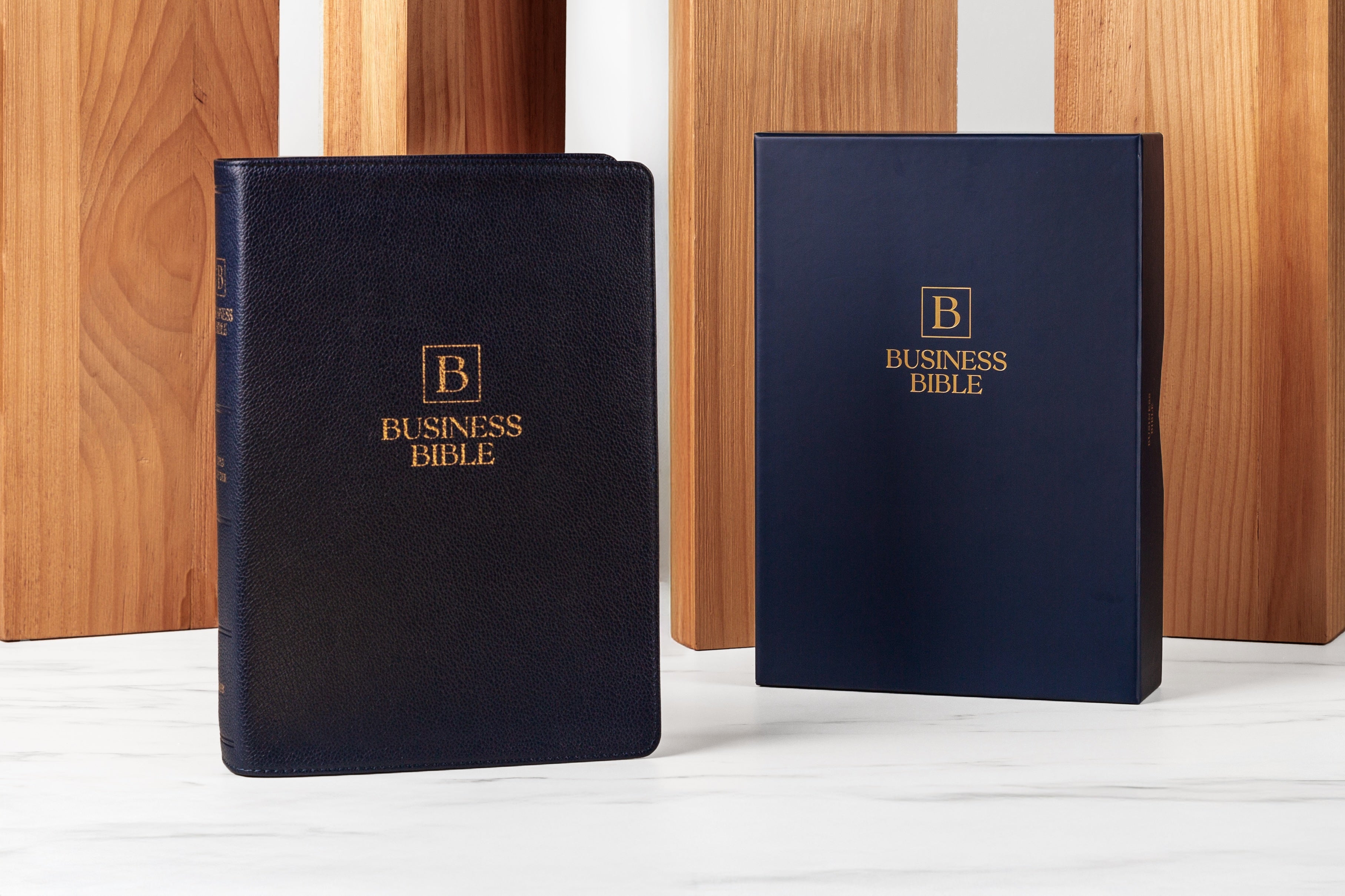 Different editions of The Business Bible: black and blue covers